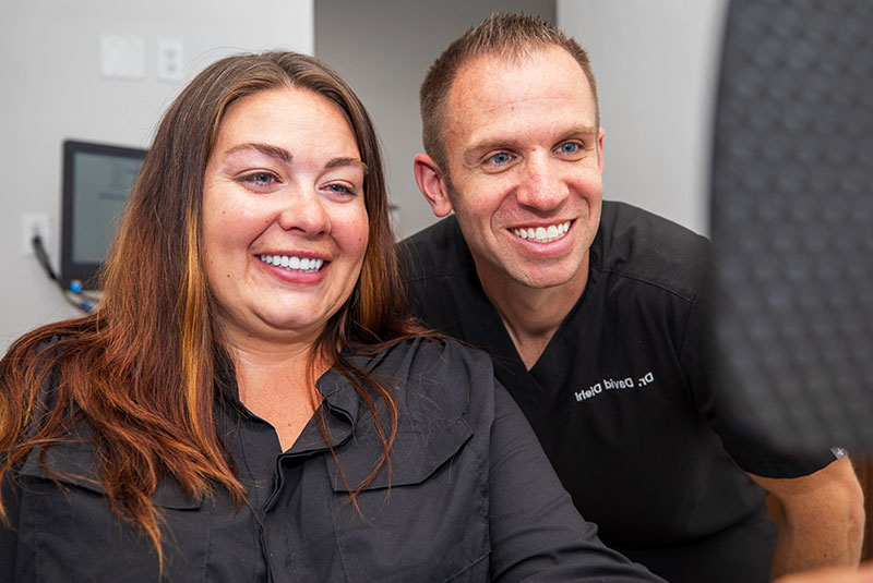 patient smiling and doctor after patient's dental procedure