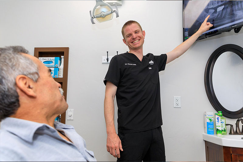 doctor going over dental procedure information with patient